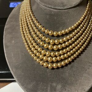 Just beautiful 6 row strand of faux pearls in that lovely creamy color